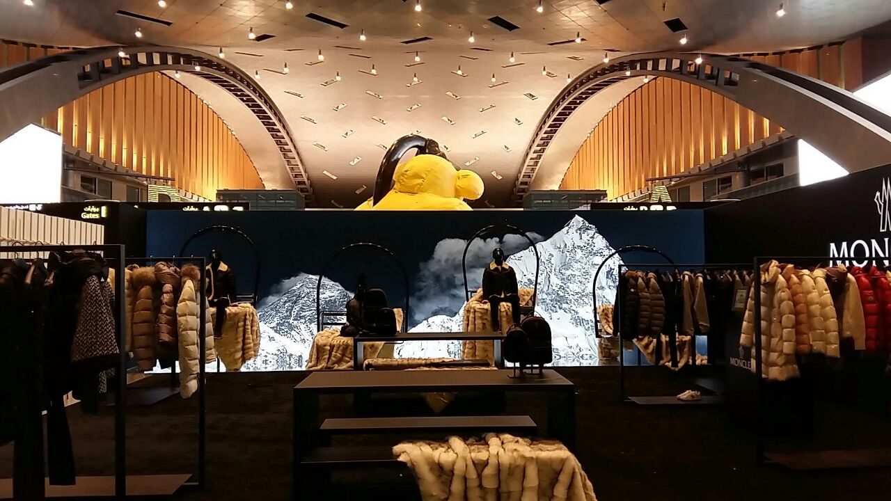 Moncler flagship retail environment with branded visual displays